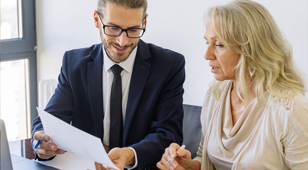 An advisor walking a client through a printed report